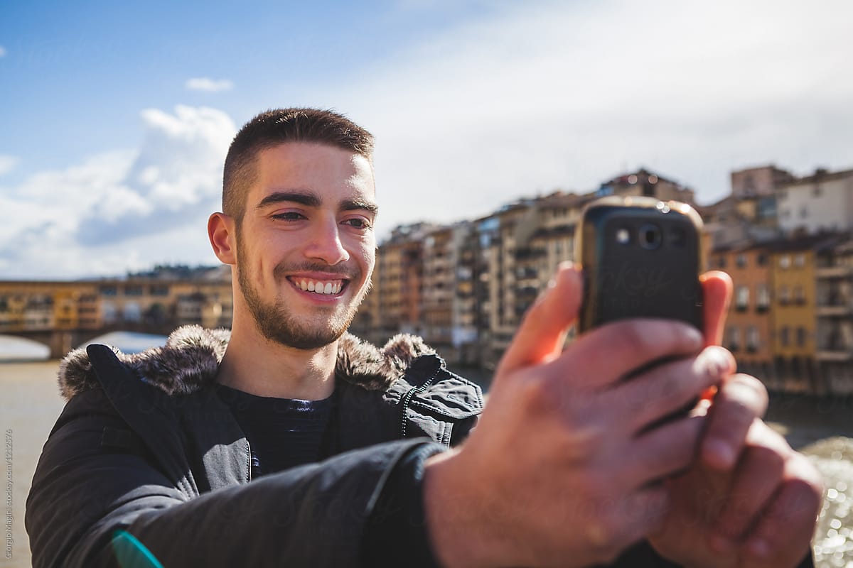 Young Man Taking a Selfie with a Mobile Phone in Florence