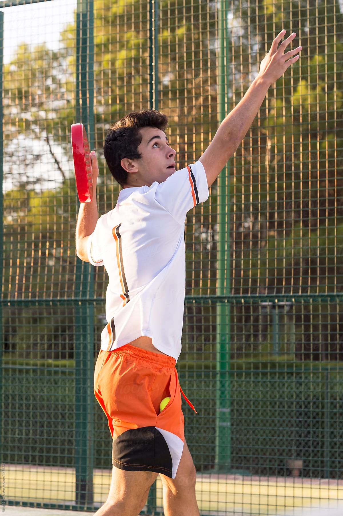 Young boy Playing Paddle Tennis Outdoors