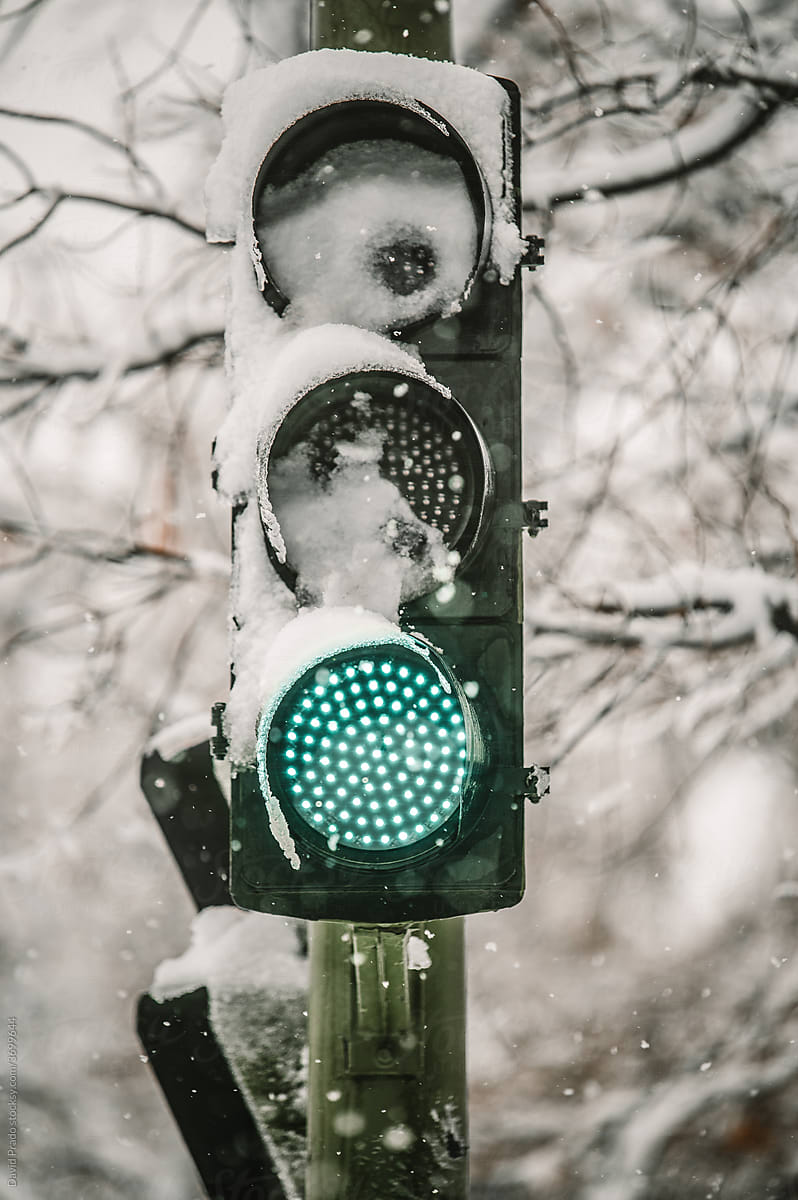Traffic light glowing with green color