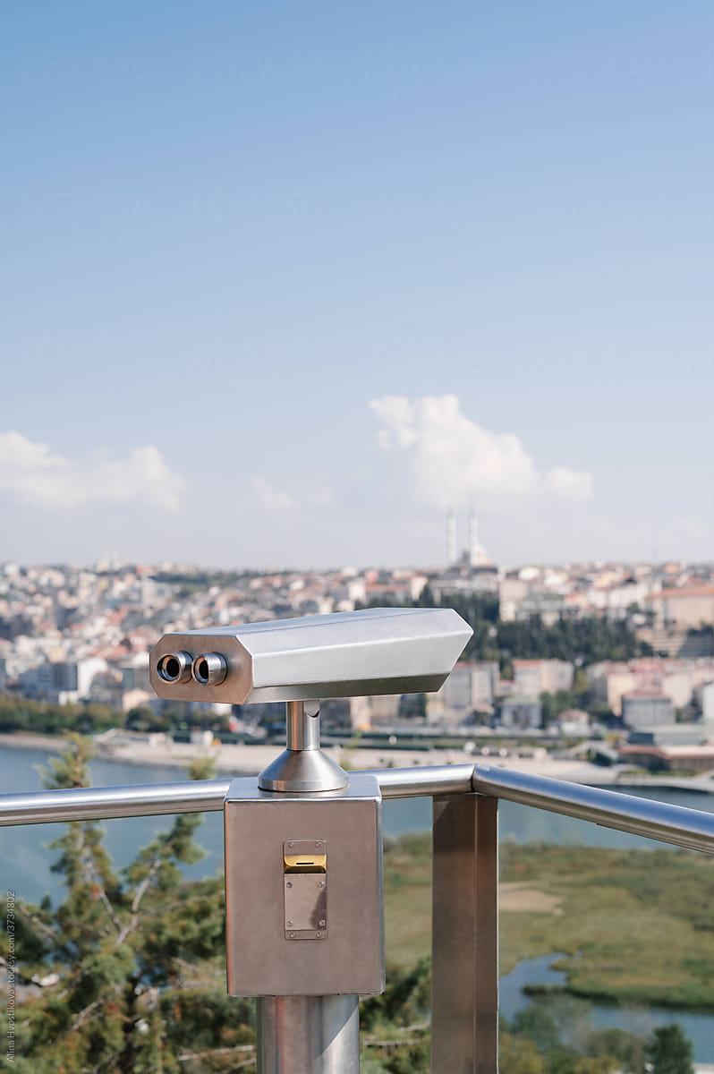 Binoculars on viewpoint in coastal city
