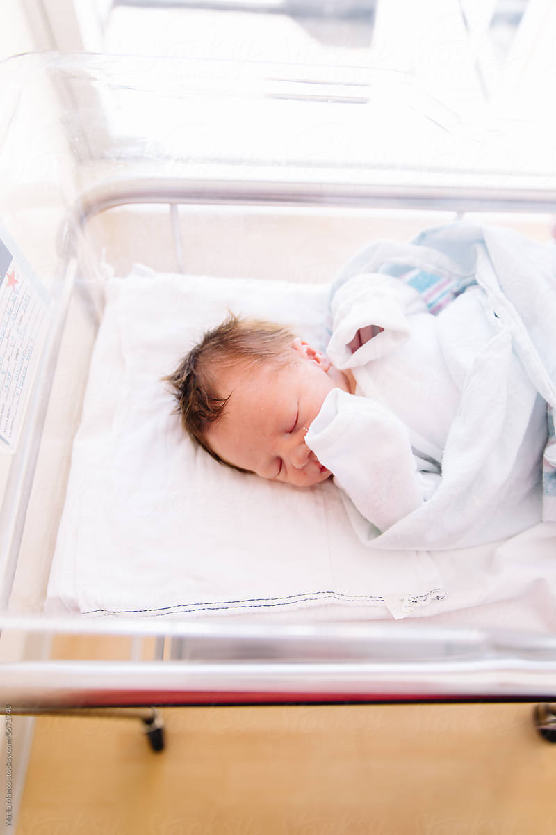 Overhead View of Newborn Baby in Hospital Bassinet