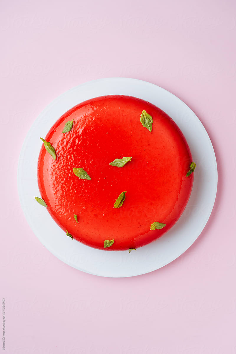 Red cake with herb leaves