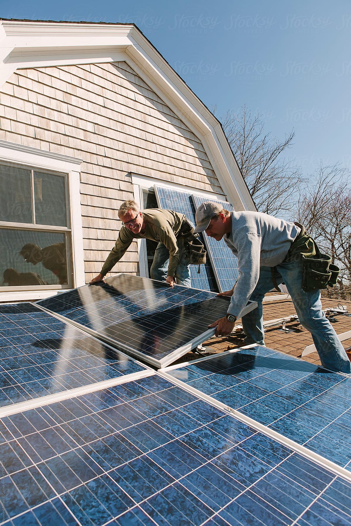 Solar Panel Installation on Home with two men