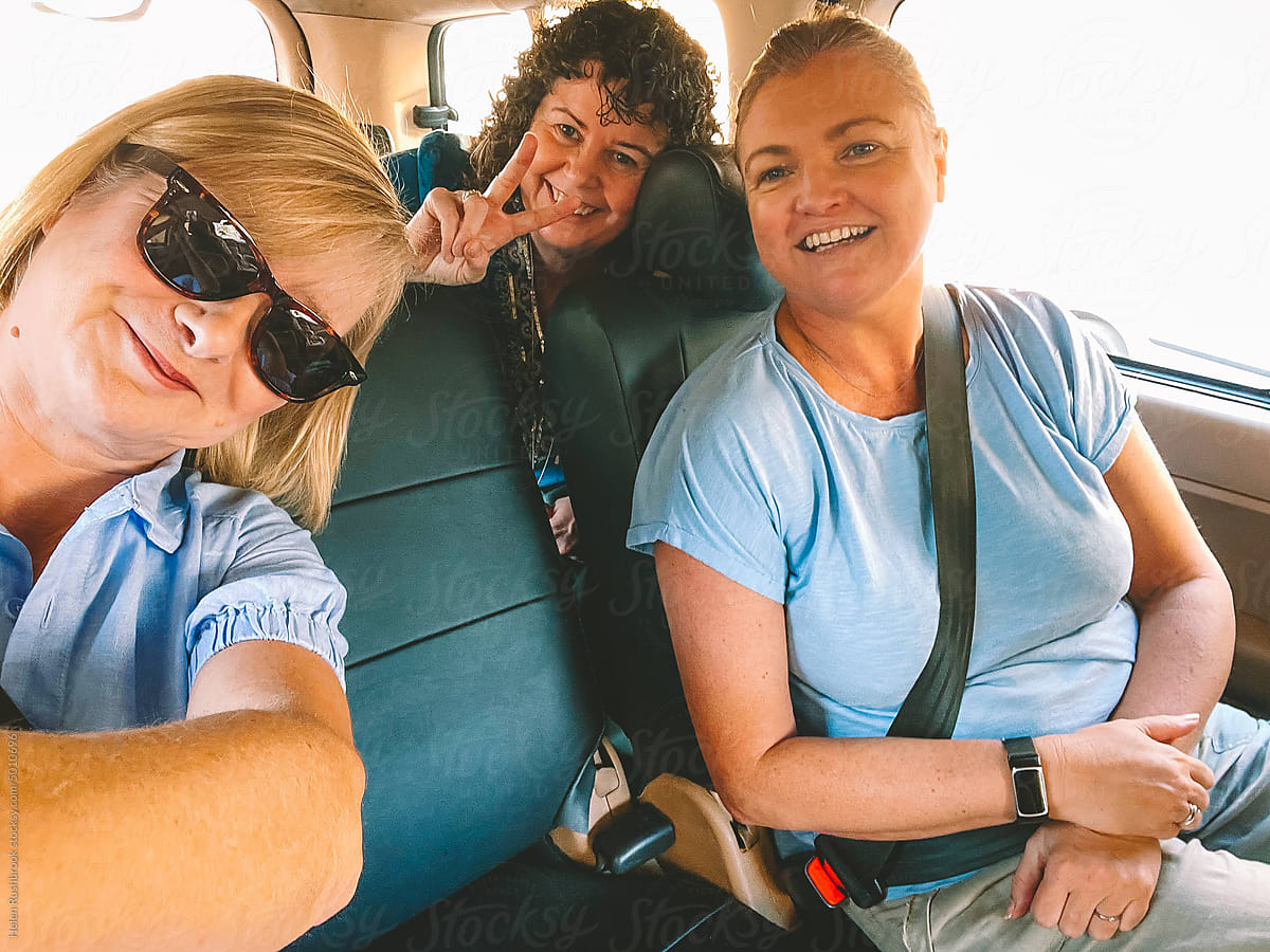 UGC selfie of 3 middle aged women on a road trip.