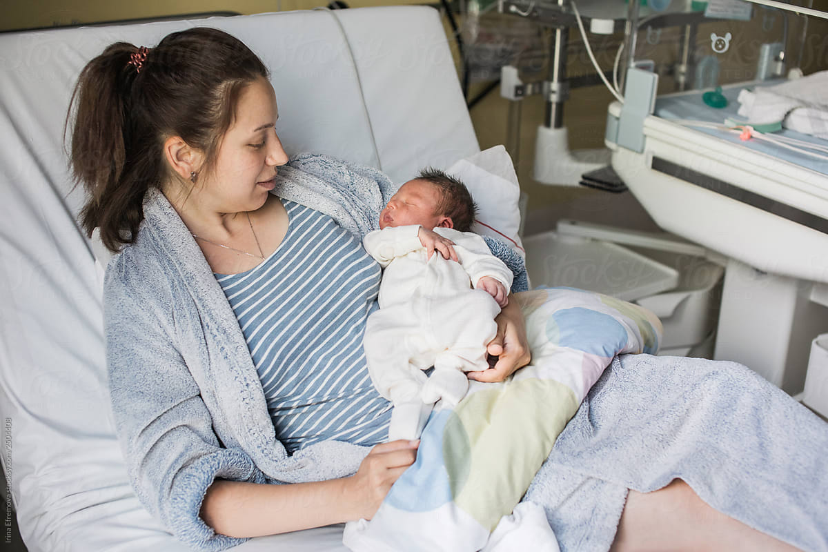 Mother and baby on a hospital bed