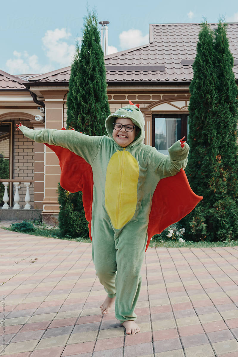 Teenager Dressed As A Dinosaur For Halloween