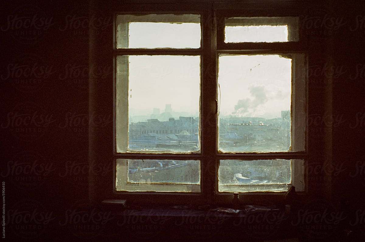 Old vintage wood window view framing the outside urban city skyline
