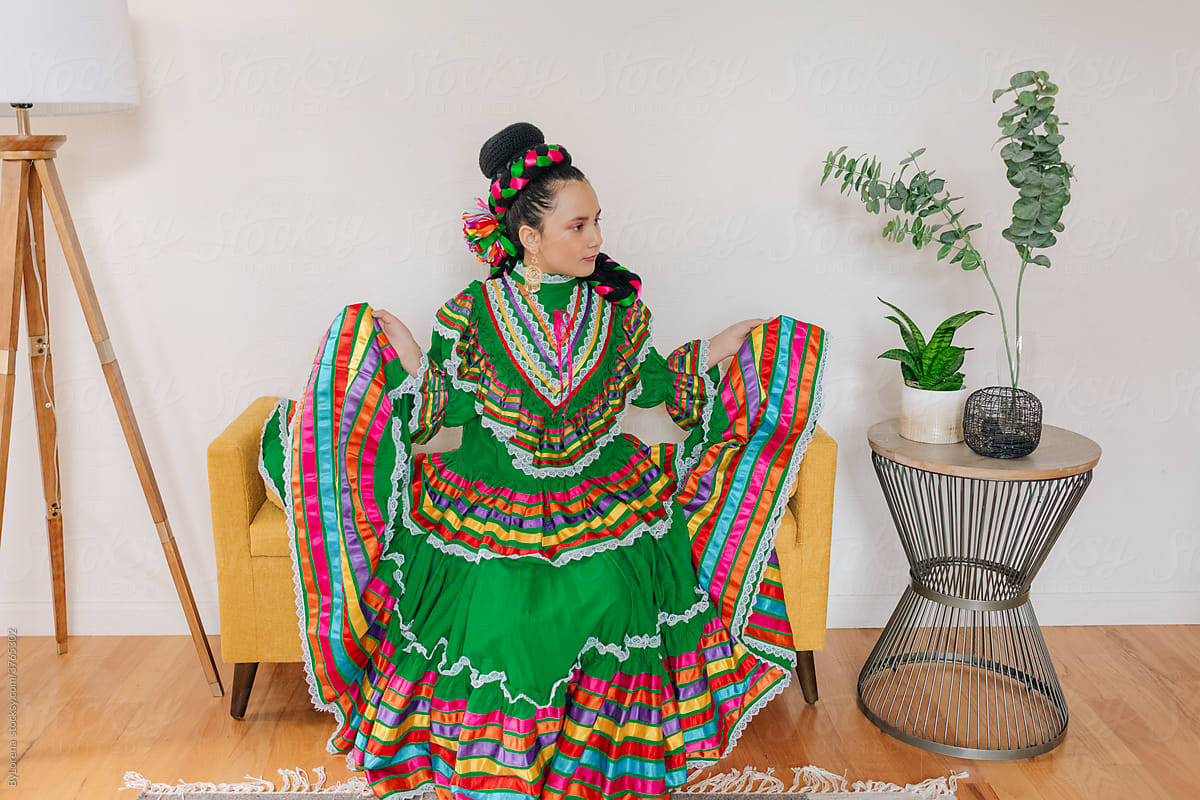 girl dressed up with Mexican dress and braid hairstyle