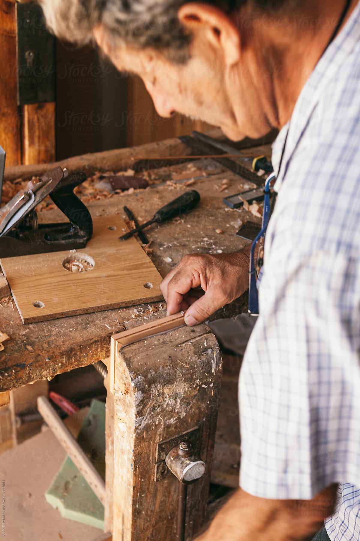 Senior Carpenter Working in His Workshop