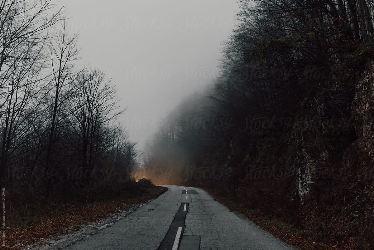 View of road on the mountain with foggy weather