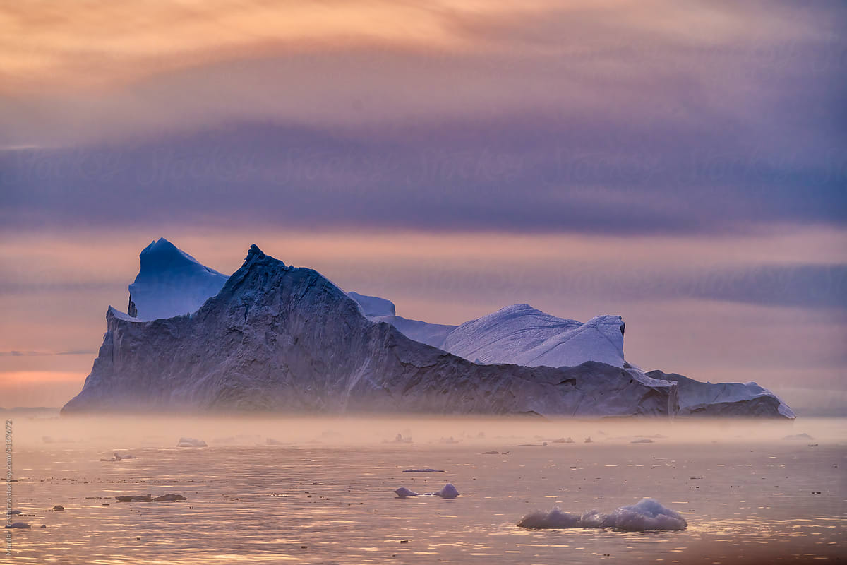 Midnight Sun And Haze On Floating Icebergs