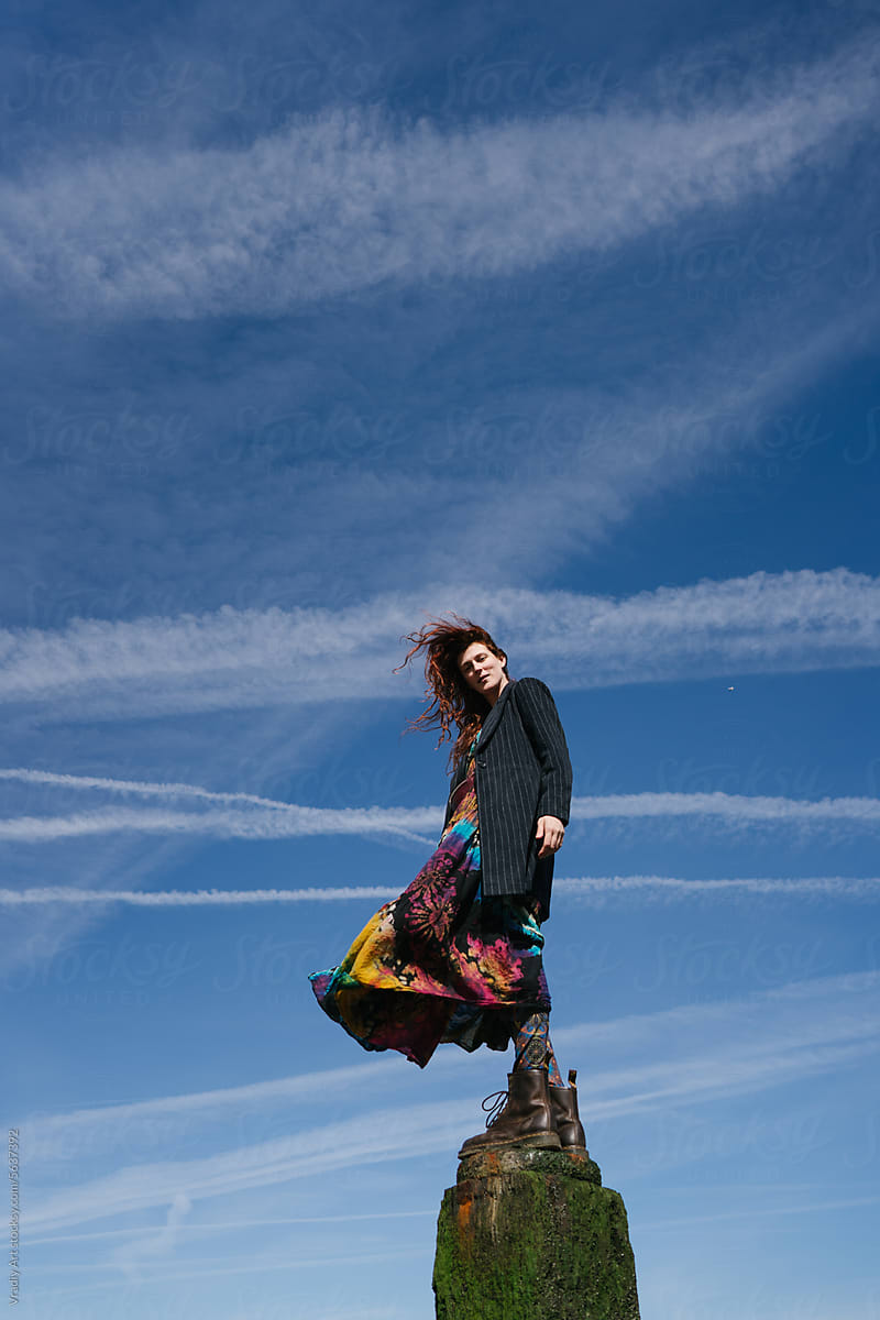 Woman against blue sky