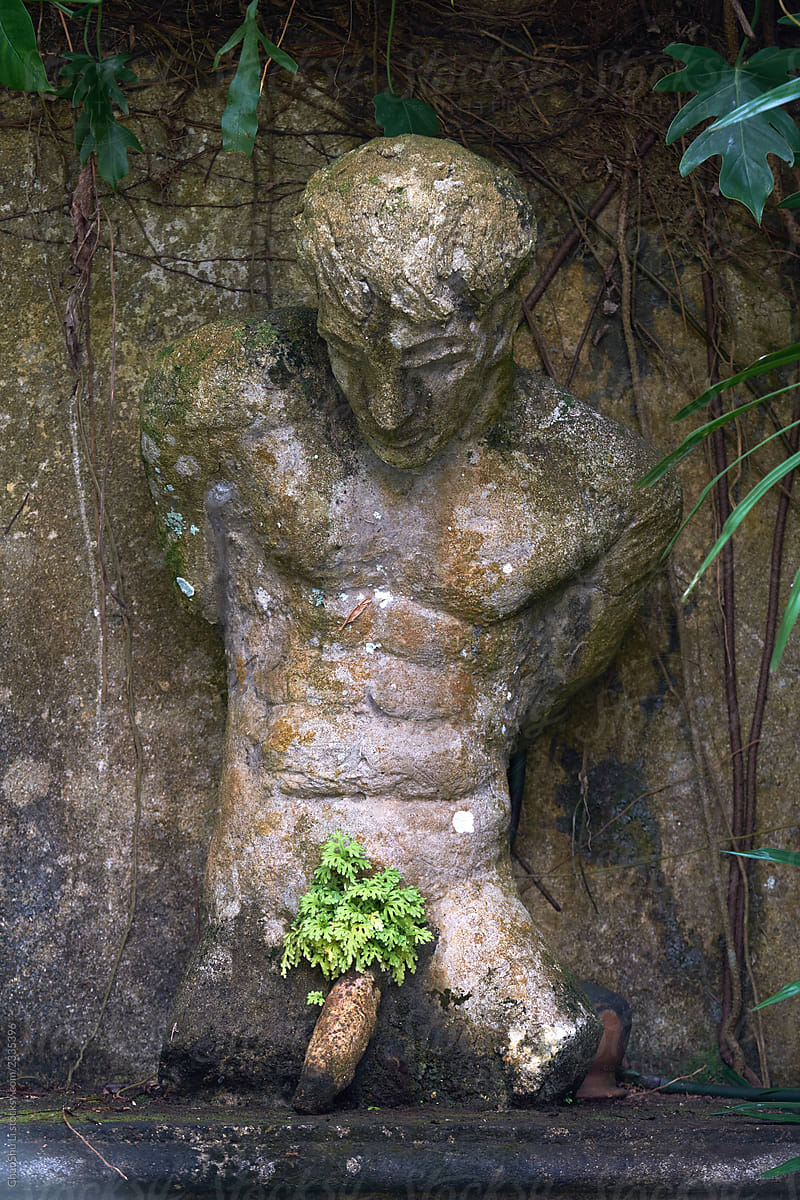 Ancient male sculptures in the woods, traveling in Sri Lanka