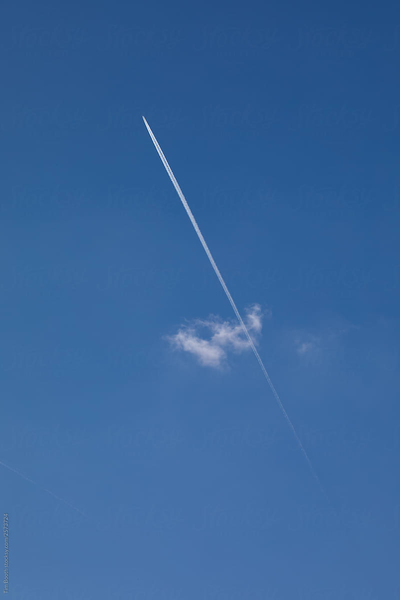 Jet trail through blue sky