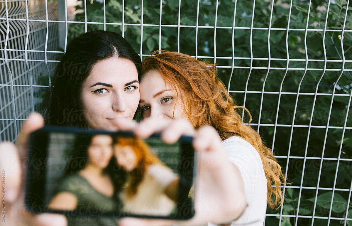 A Lesbian Couple Taking A Selfie Outdoors Poralexey Kuzma 