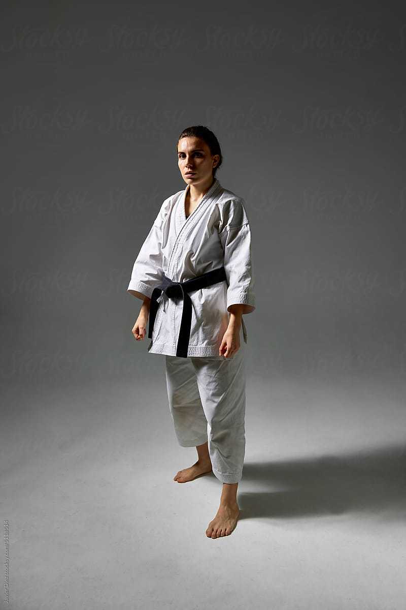 Woman in Karate uniform under blue light