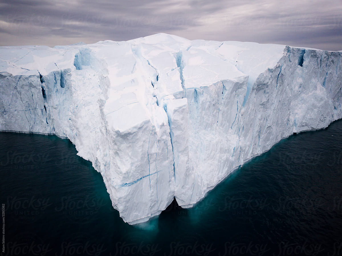 Arctic Greenland iceberg melting, calving from Jakobshavn glacier, stunning cliffs of snow