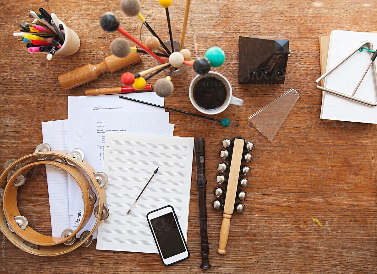 Overhead view of a music teacher\'s desk with random instruments