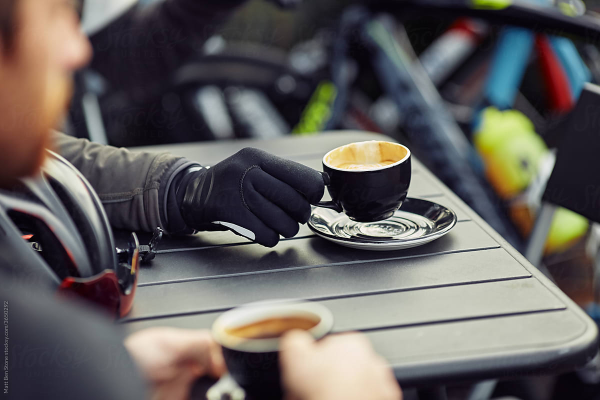 Male Road Cyclist stops for coffee mid ride