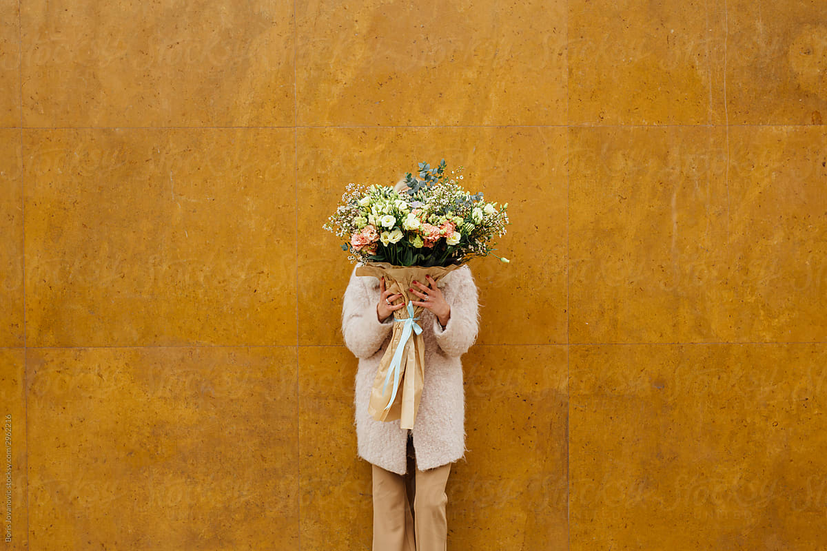 A Portrait Of An Anonymous Girl Holding A Bouquet