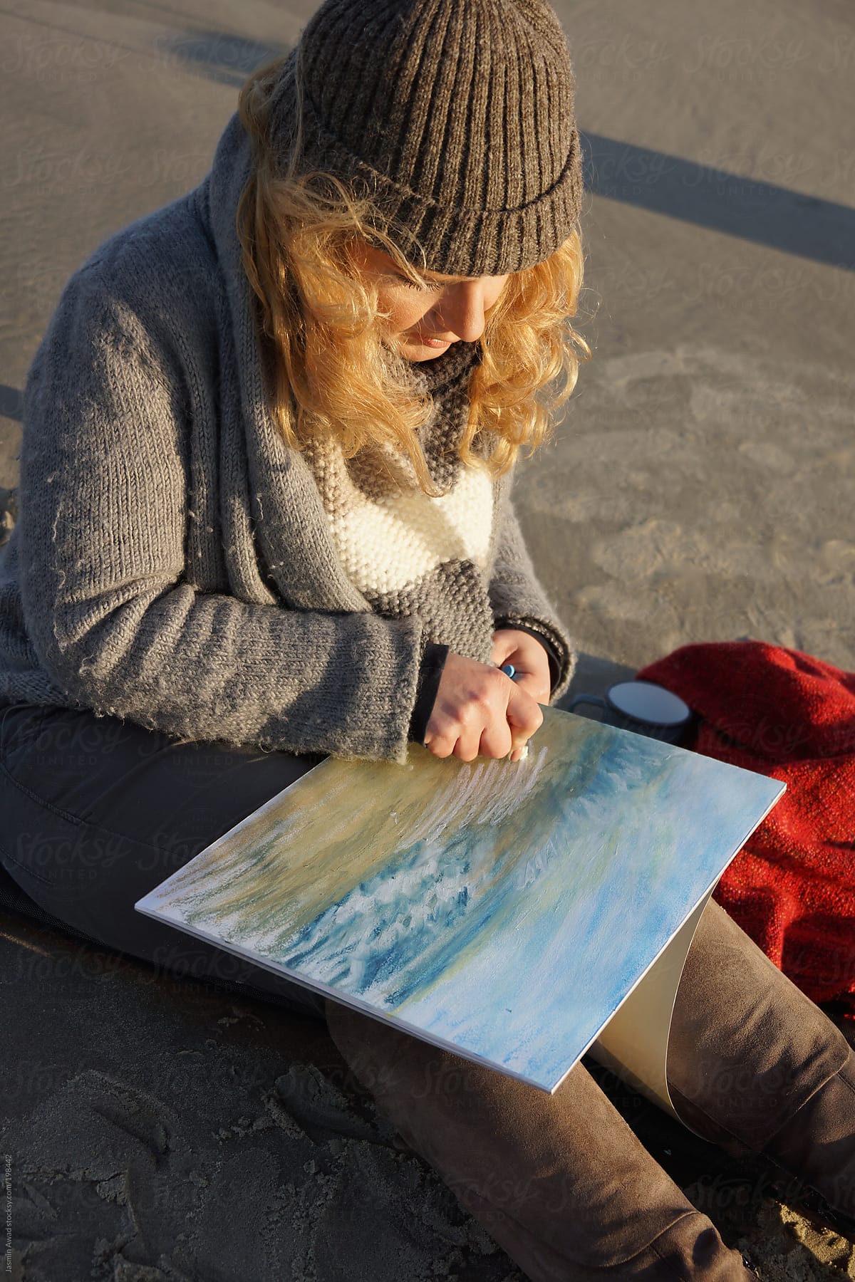 Artist painting at the beach