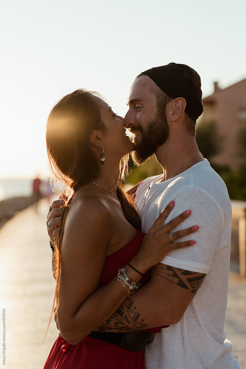 Happy Couple Kissing by Stocksy Contributor Mauro Grigollo