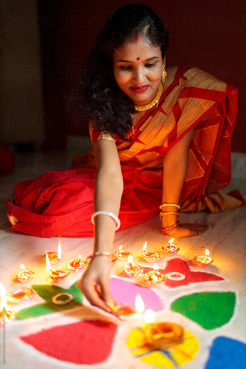Premium Photo | Beautiful indian girl holding diya on diwali festival  night, top view.selective focus
