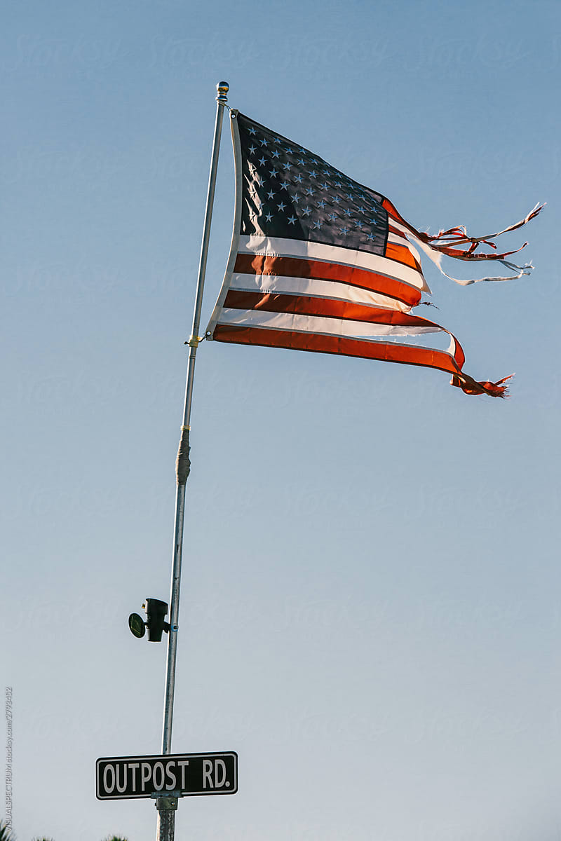 Weathered American Flag Blowing in the Wind