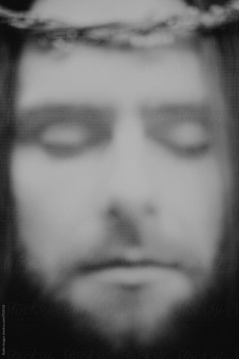 Close up of man resembling Jesus Christ, eyes closed