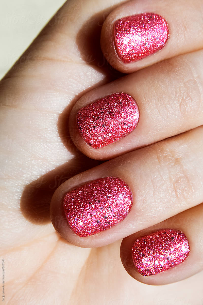 pink sparkling shiny nails closeup