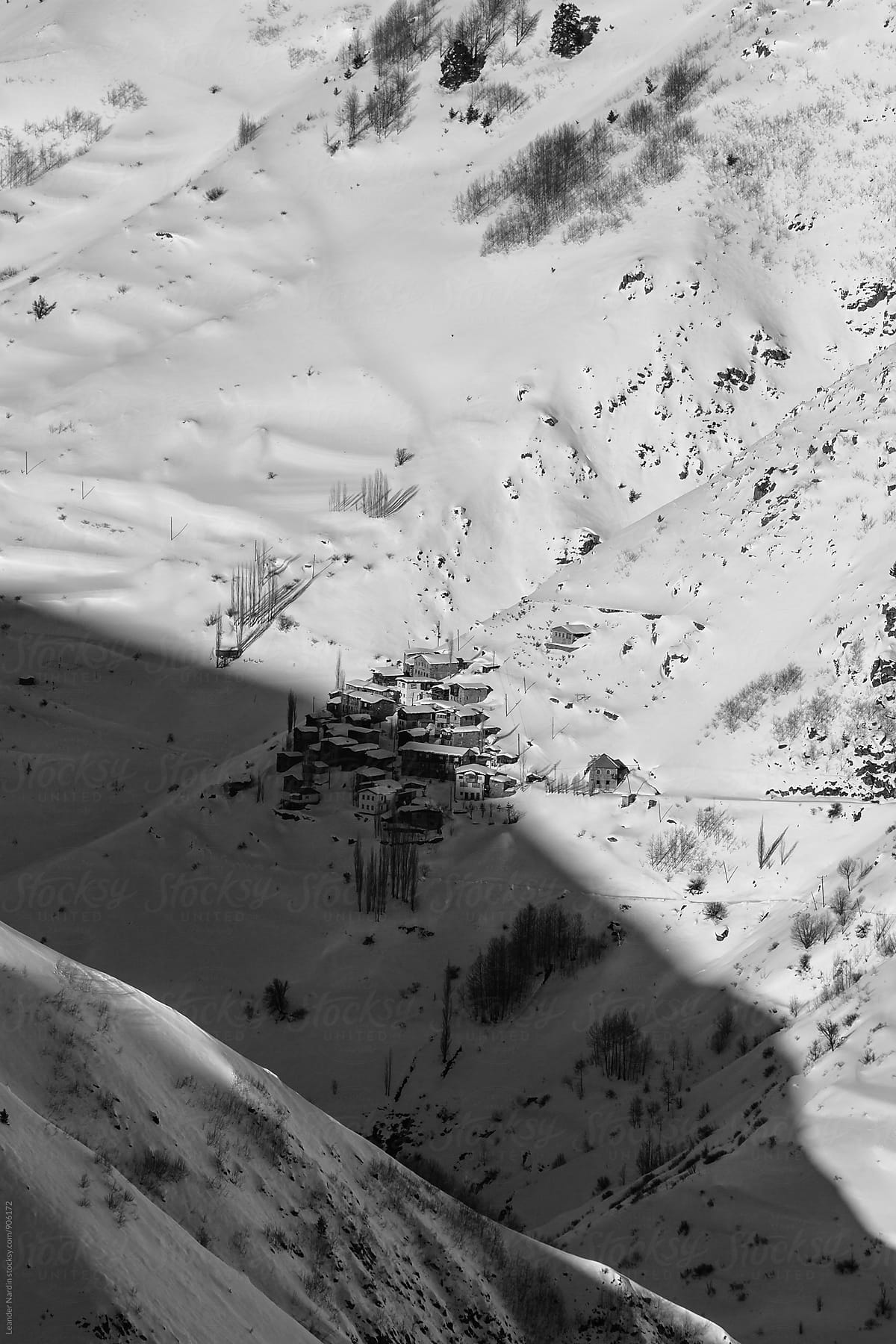 small remote village in snowcovered mountain landscape in east anatolia, turkey - black and white