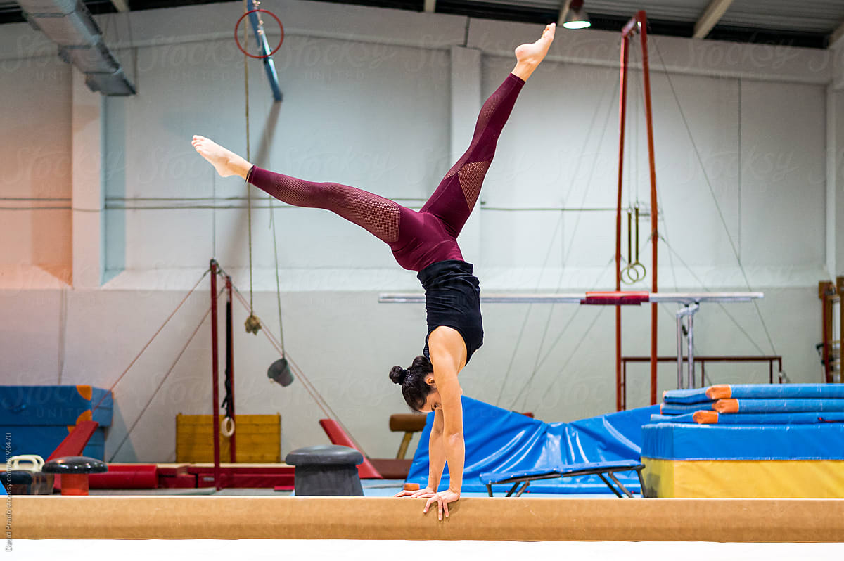 young artistic gymnast woman performing and training
