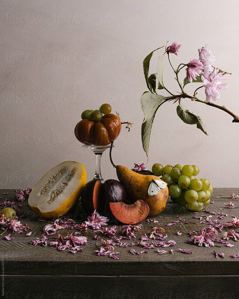 Still life of fruit and flowers on wood table