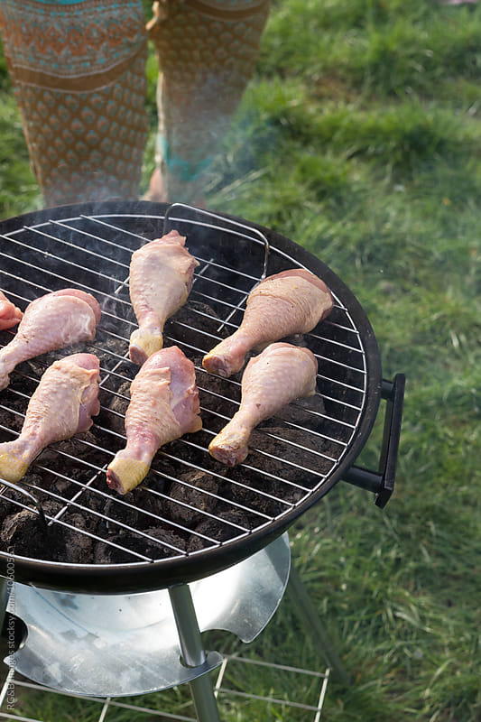 Raw chicken on the barbecue outdoor