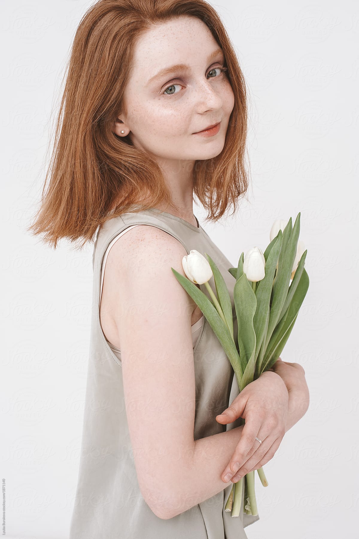 Young woman with white tulips