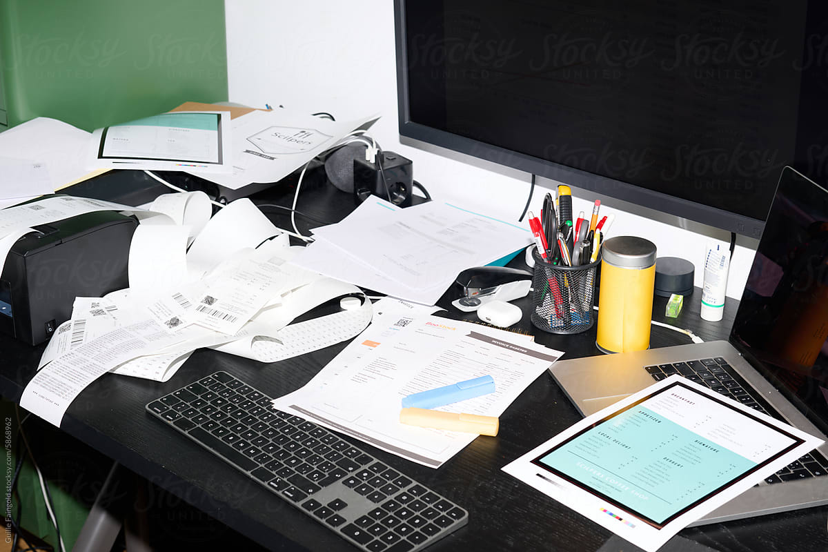 Overwhelmed Desk with business receipts