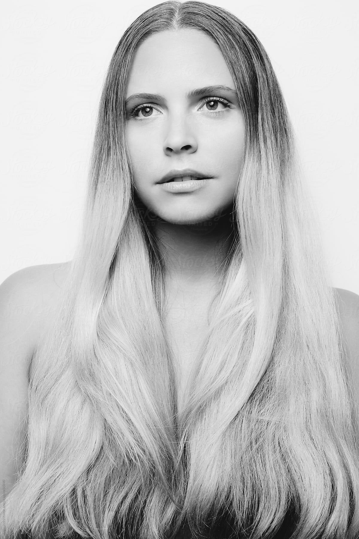 Black and white portrait of woman with long blond hair.
