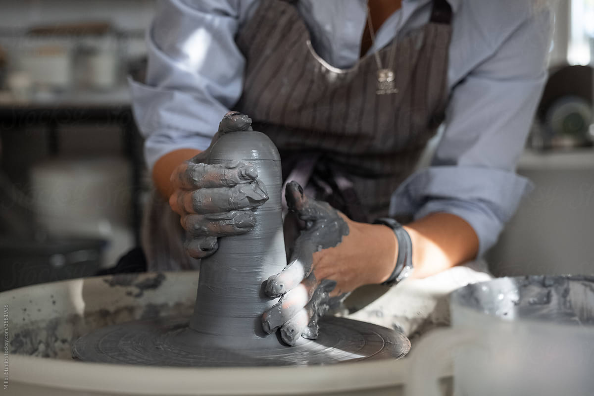 Female potter working with wet clay