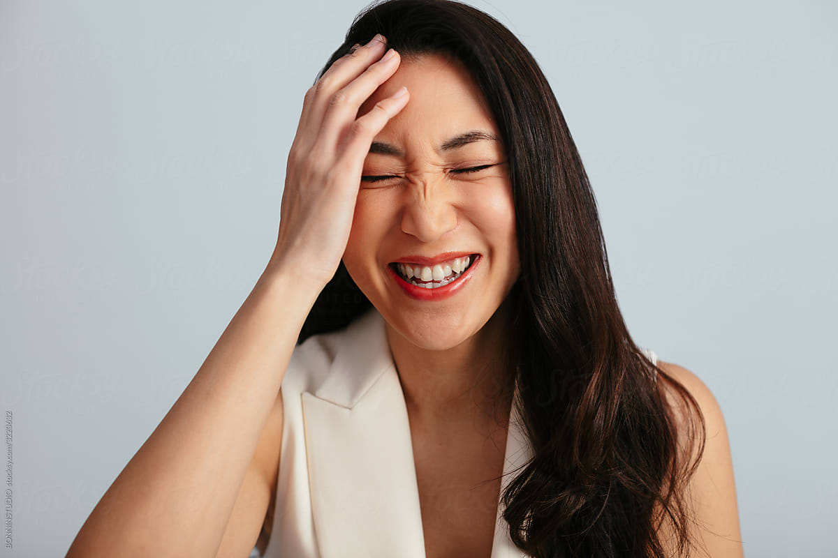 Asian Woman laughing in studio