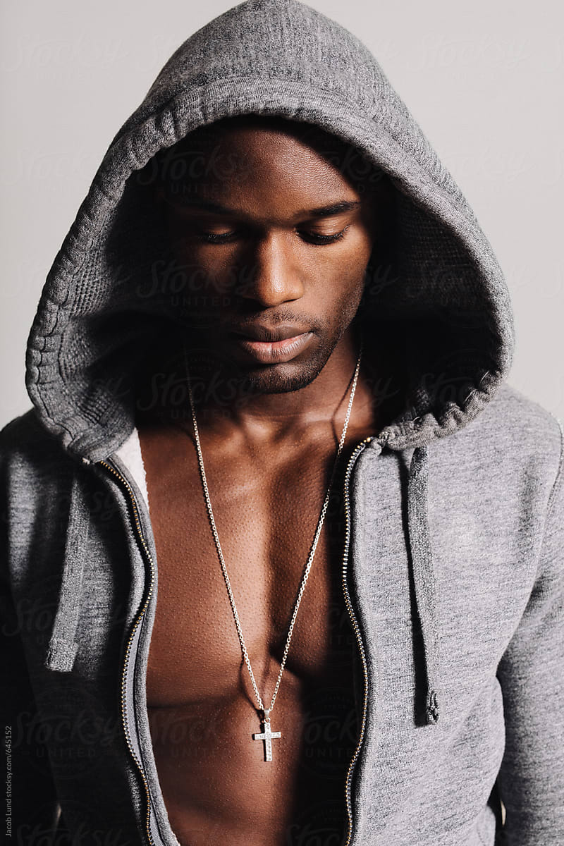 African Male Model Looking Down By Stocksy Contributor Jacob Lund
