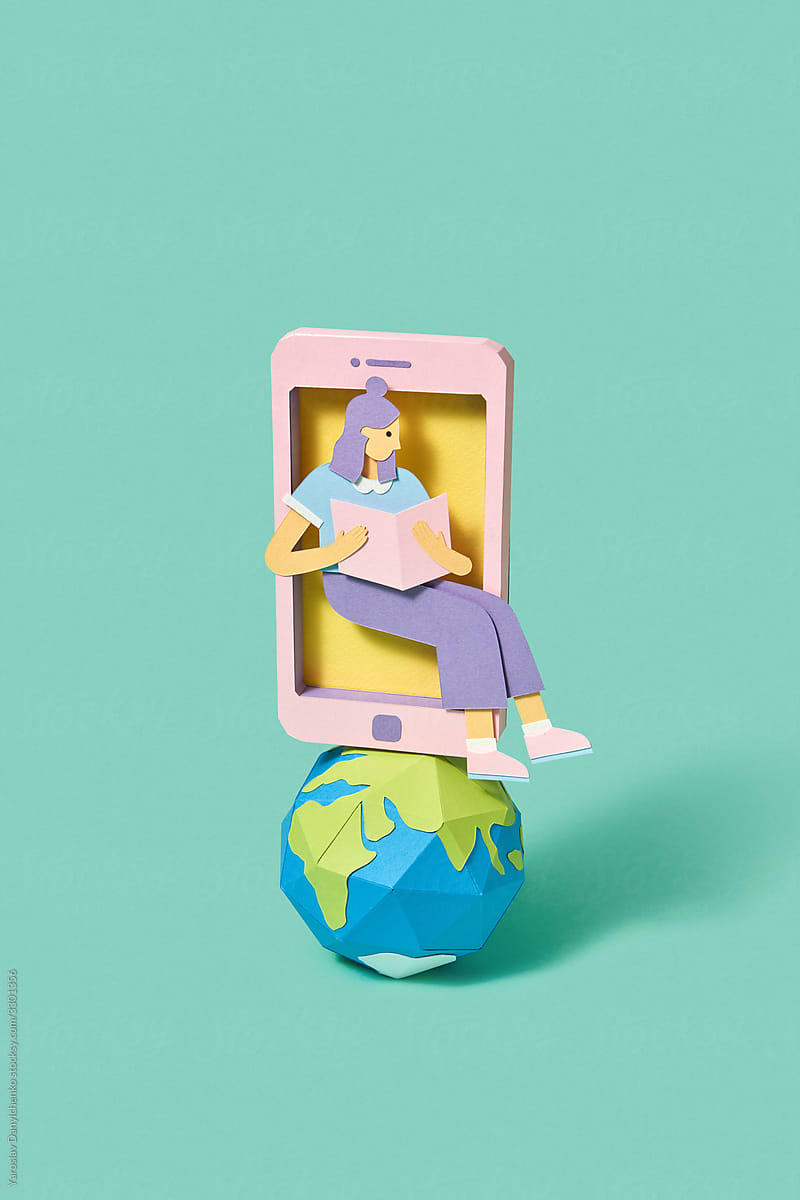 Papercraft phone with girl reading book on a globe.