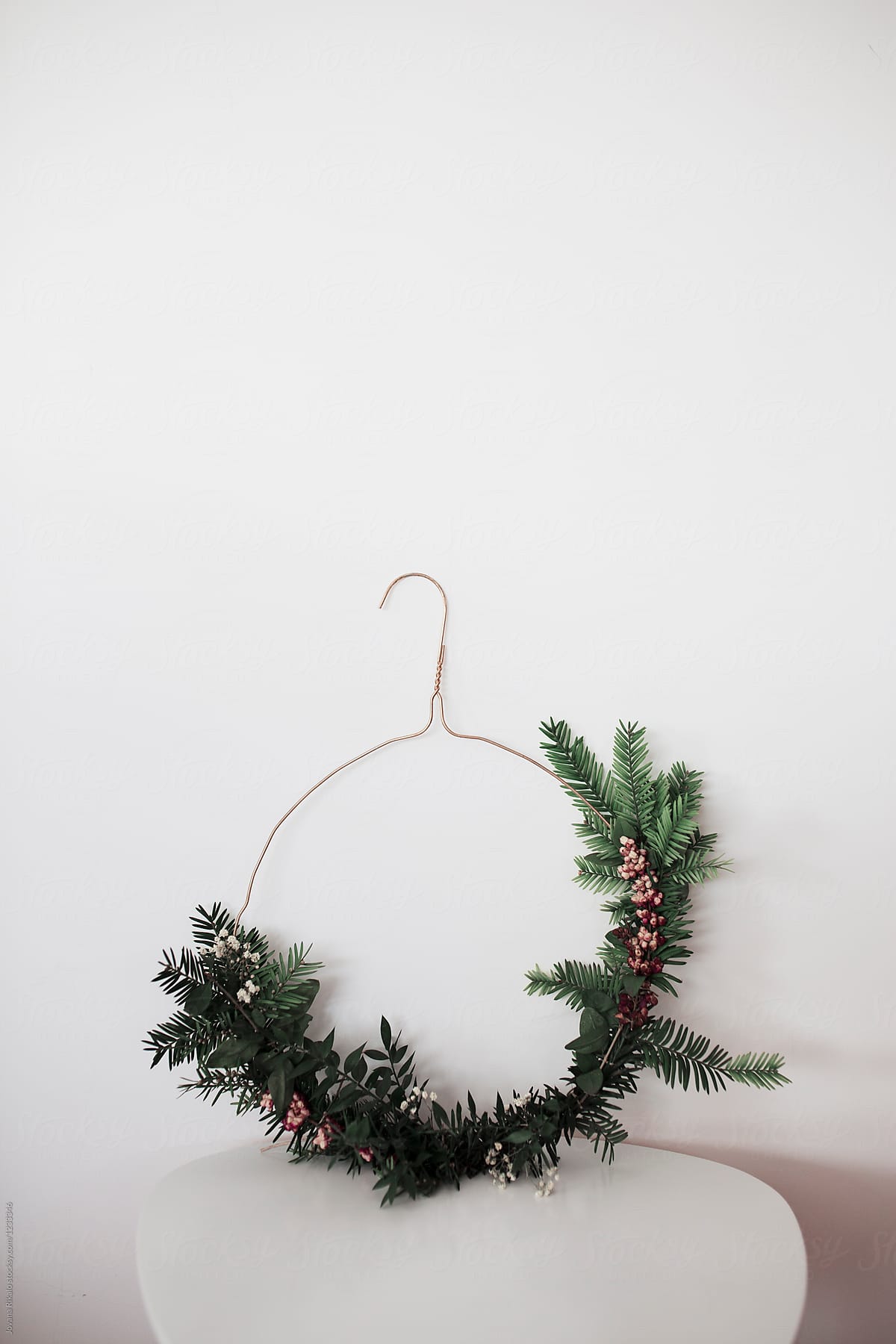 Coat hanger decorate with fir and berries