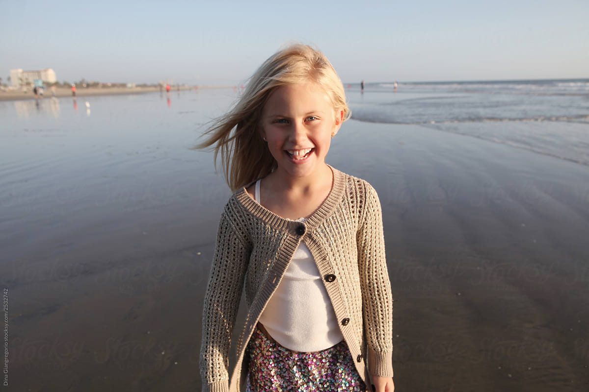 Girl Standing on Wide Open Beach