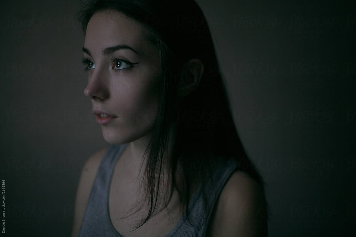 Portrait Of A Beautiful Girl In A Dark Light By Demetr White