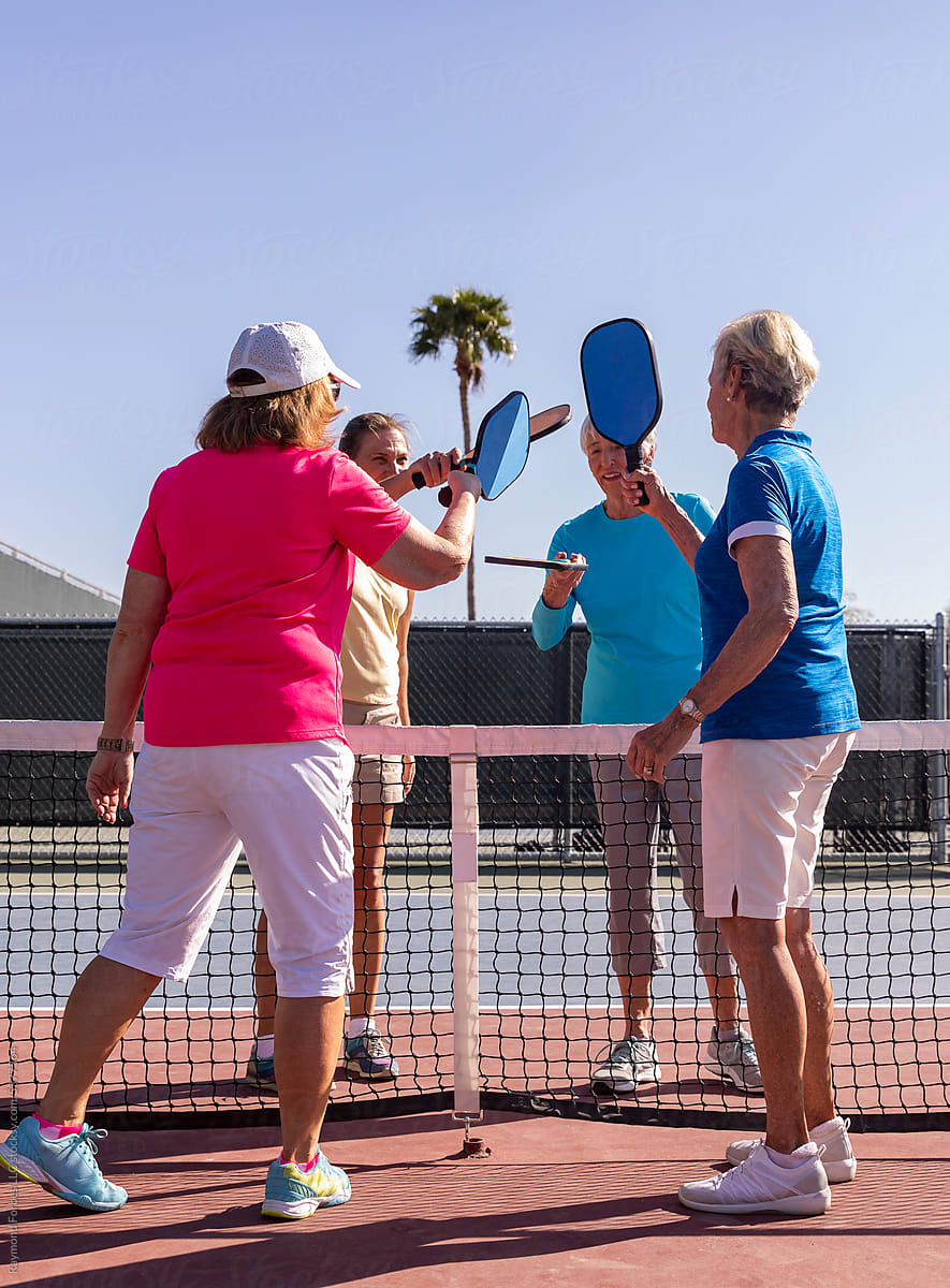 Pickleball players  Touch paddles on court  after match Arizona