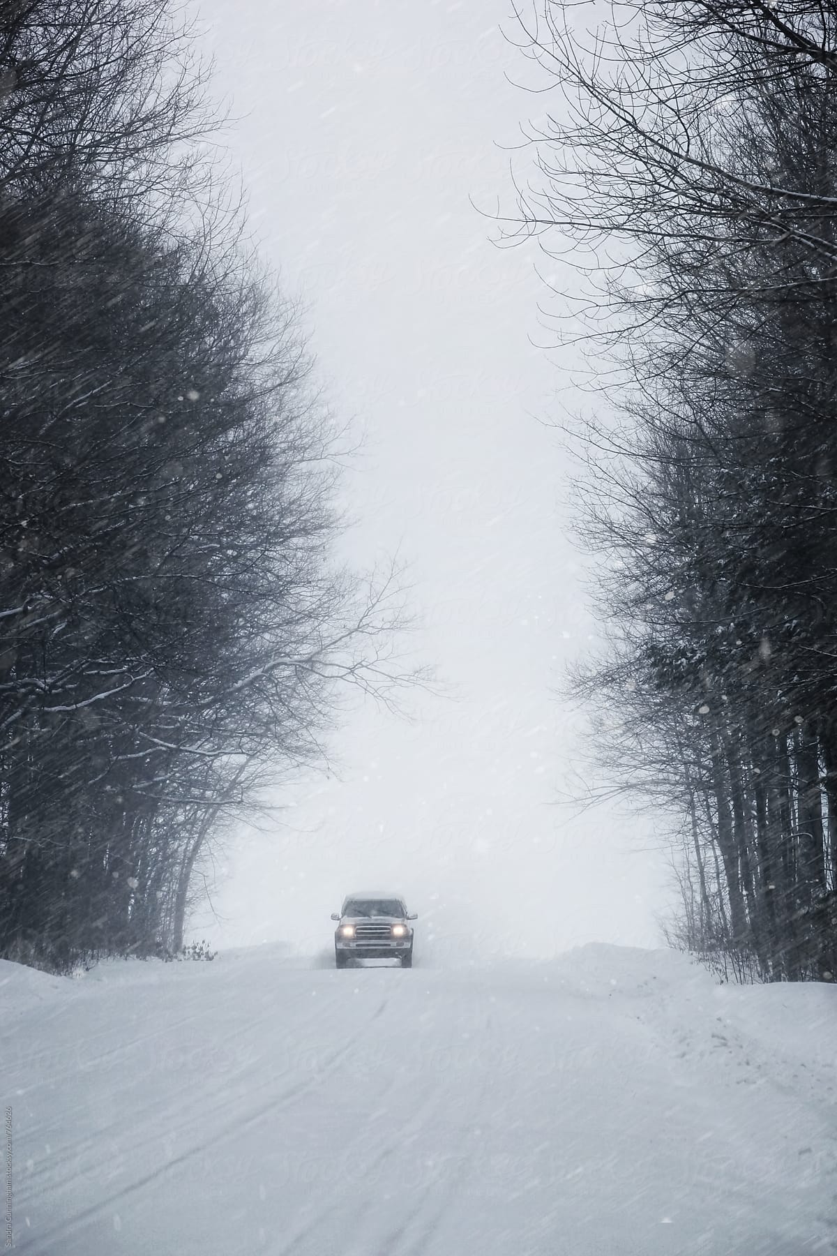Truck approaching on snow covered road