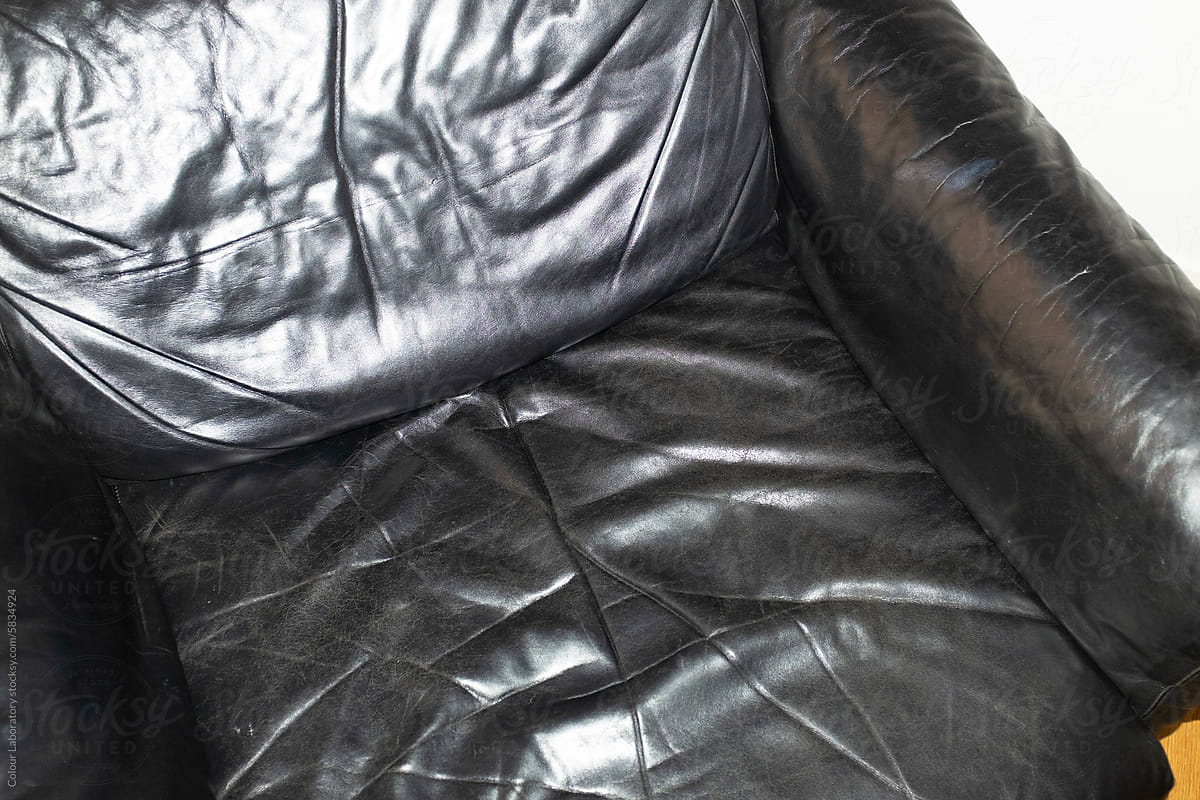 Black leather sofa with hard direct flashlight