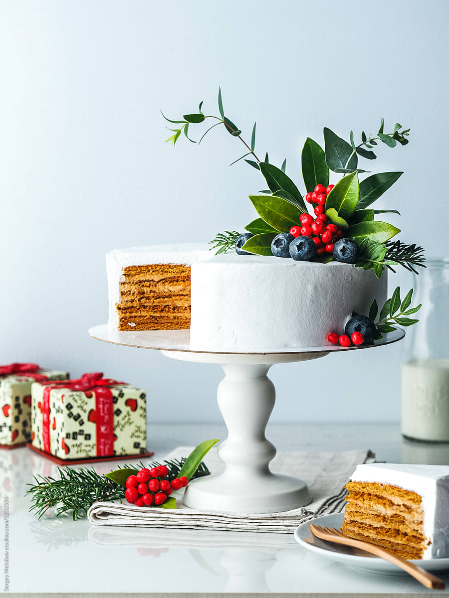 Honey layer cake with cream and floral decoration