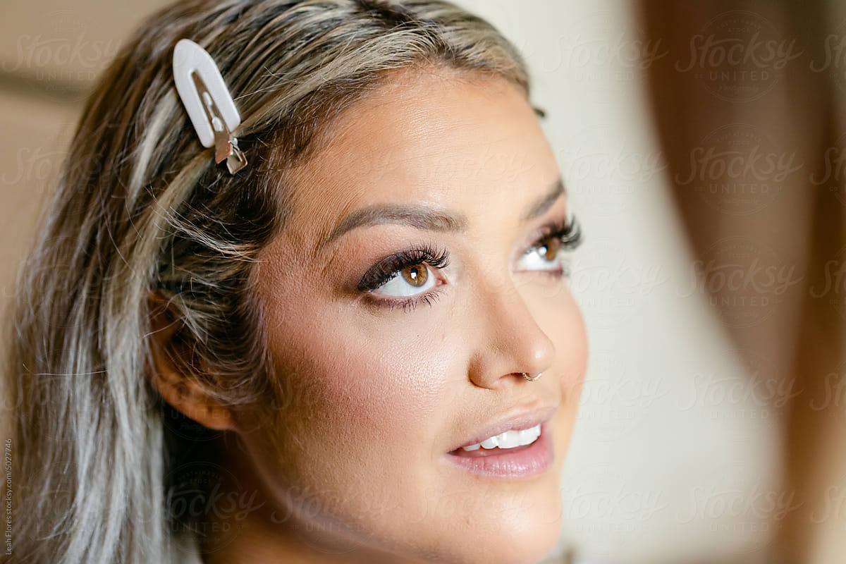 Closeup of Bride as She Gets Her Makeup Done