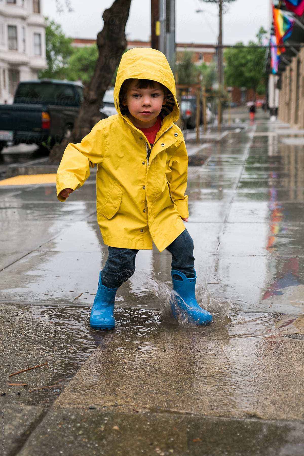 Little boy in puddle